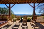 Covered Deck off Basement Features Large 7 Person Hot Tub, Rocking Chairs, Hammock, and Breathtaking Mountain Views